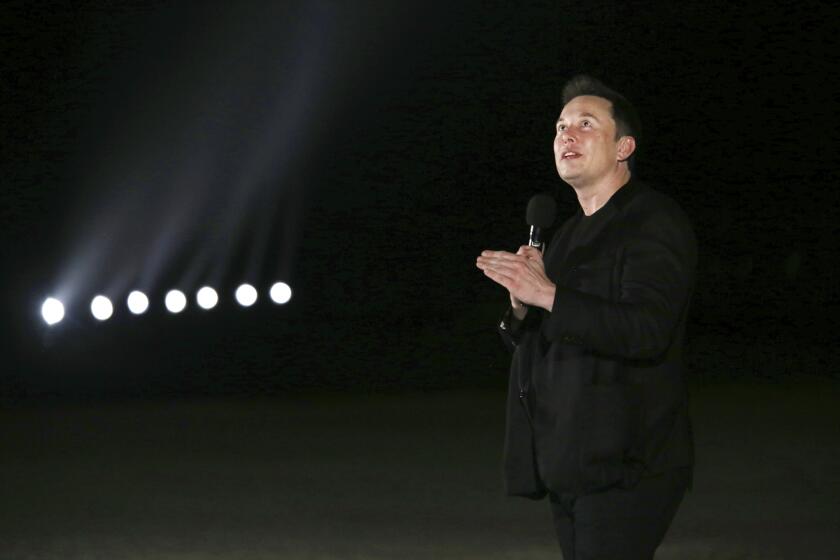 In this Saturday, Sep. 28, 2019 photo, SpaceX Founder and CEO Elon Musk delivers a presentation on Starship development at the company's Boca Chica Launch Complex near Brownsville, Texas. (Miguel Roberts/The Brownsville Herald via AP)