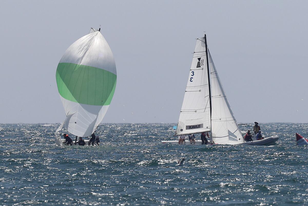 Newport Harbor Yacht Club's Morgan Pinckney, left, competes against Annapolis Yacht Club's Porter Kavle in the petit final.