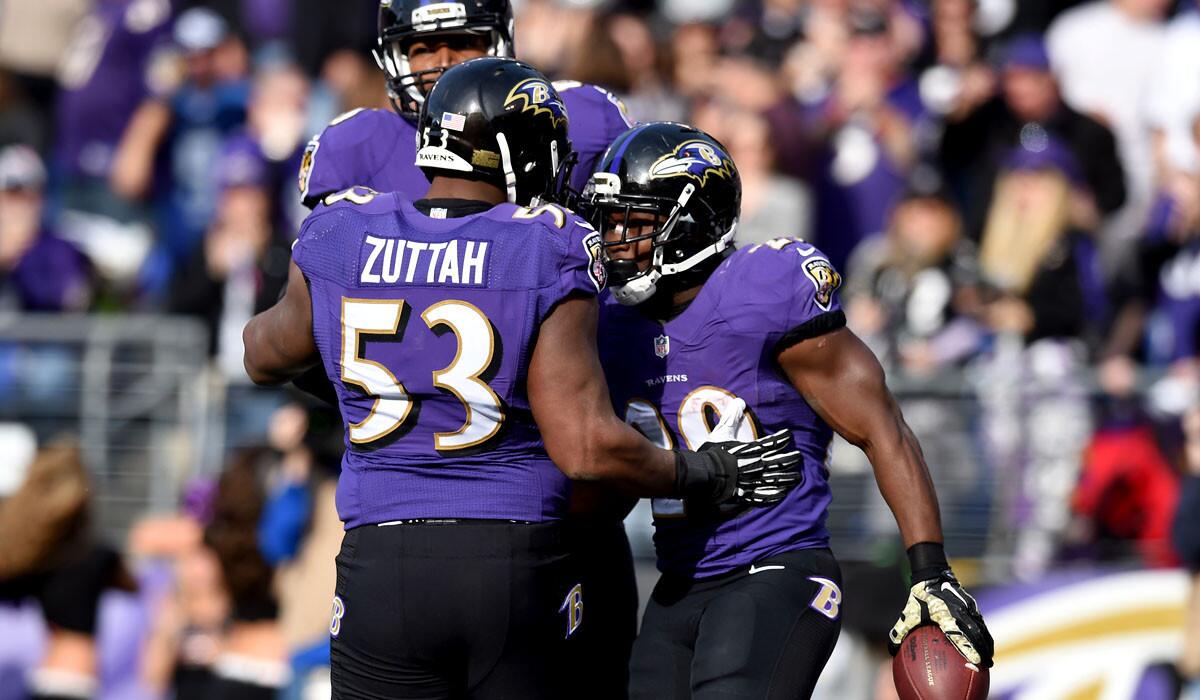 Ravens running back Justin Forsett is congratulated by center Jeremy Zuttah and wide receiver Torrey Smith after scoring against the Titans earlier this season.