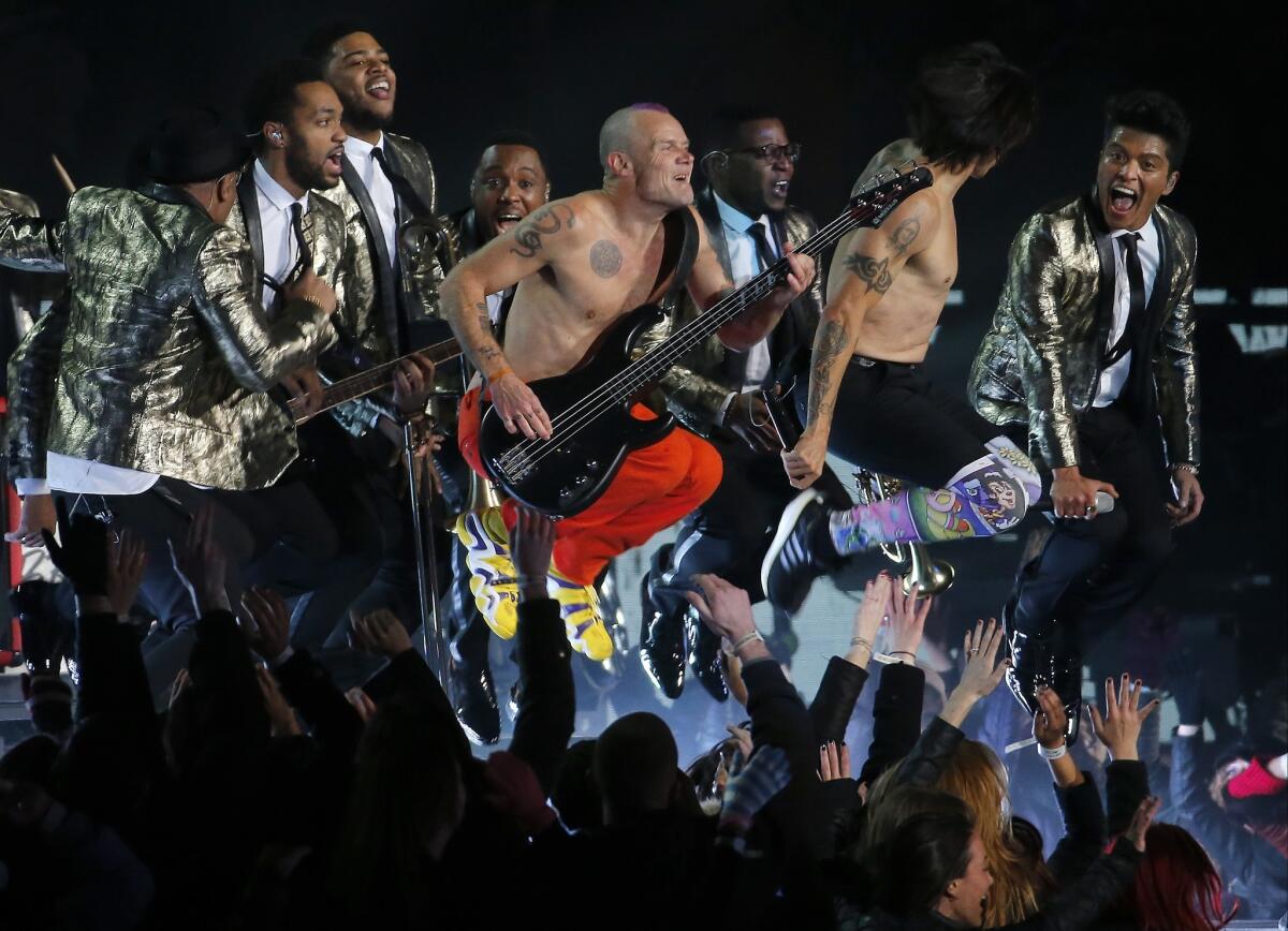 Some 115 million people watched Bruno Mars, far right, and the Red Hot Chili Peppers perform during the Super Bowl XLVIII halftime show.