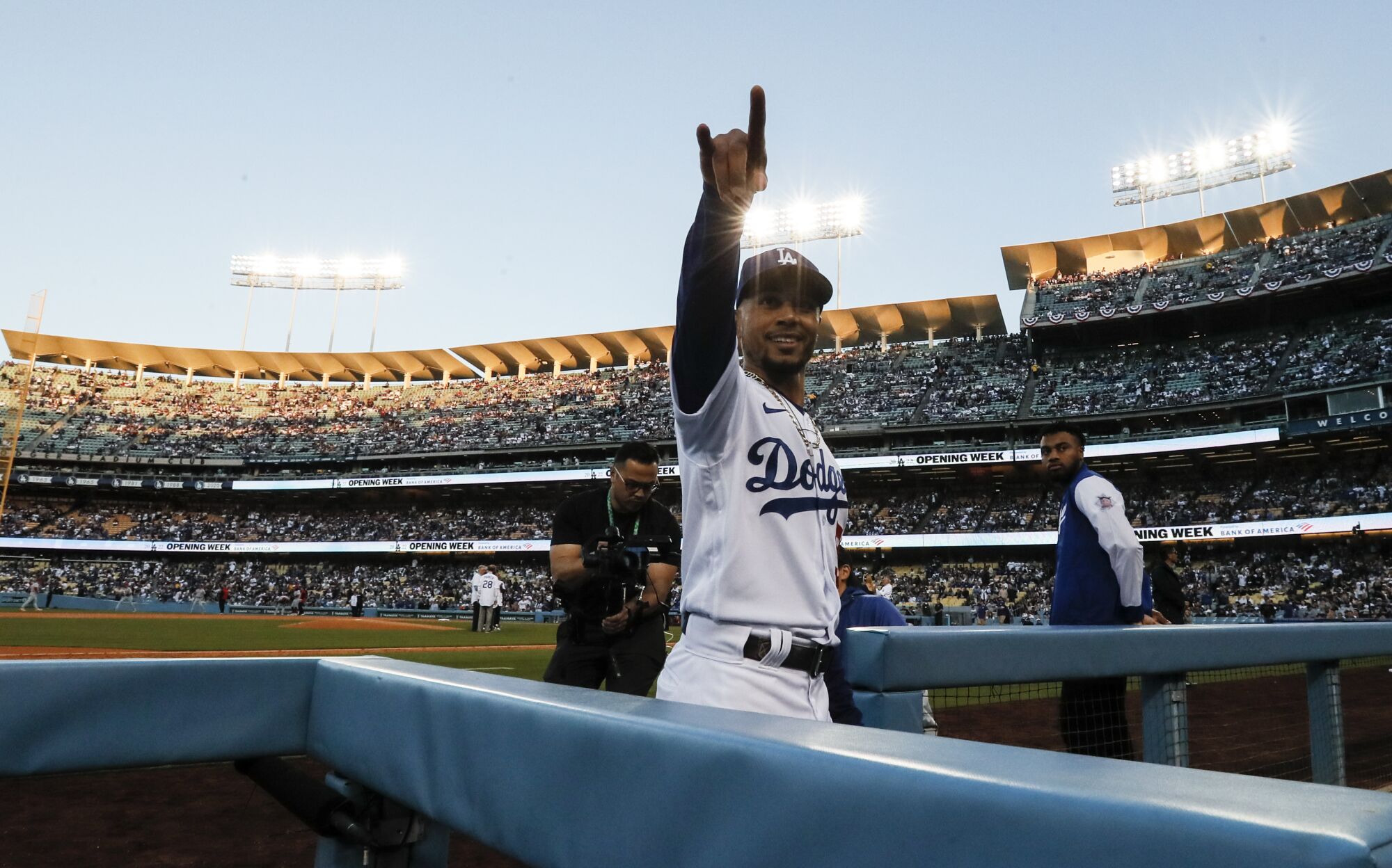 Dodgers right fielder Mookie Betts (50) points to the stands before the game against the Cincinnati Reds
