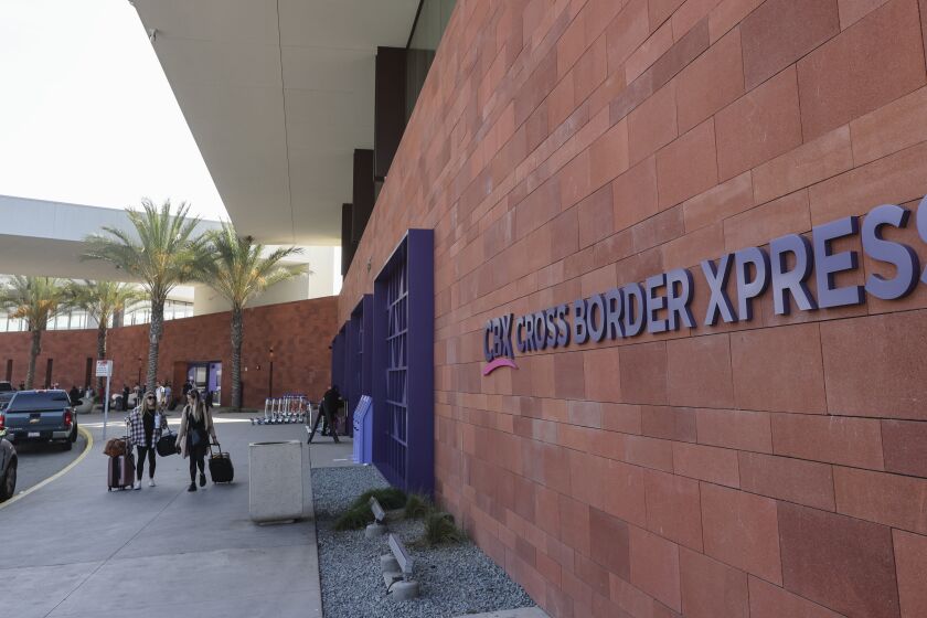 SAN DIEGO, CA - NOVEMBER 05: On the border with the U.S. and Mexico, travelers use the Cross Border Xpress CBX on Friday, Nov. 5, 2021 in San Diego, CA. (Eduardo Contreras / The San Diego Union-Tribune)