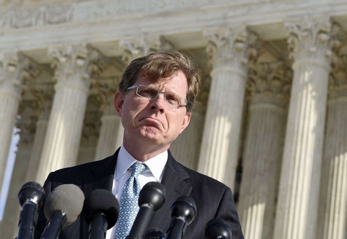 John P. Elwood, attorney for Anthony D. Elonis, who claimed he was just kidding when he posted a series of graphically violent rap lyrics on Facebook about killing his estranged wife, shooting up a kindergarten class and attacking an FBI agent, speaks to reporters outside the Supreme Court in Washington.