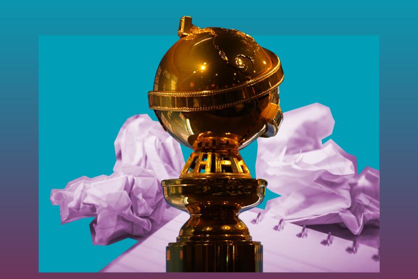 A Golden Globe statue with a notepad and crumpled paper in the background