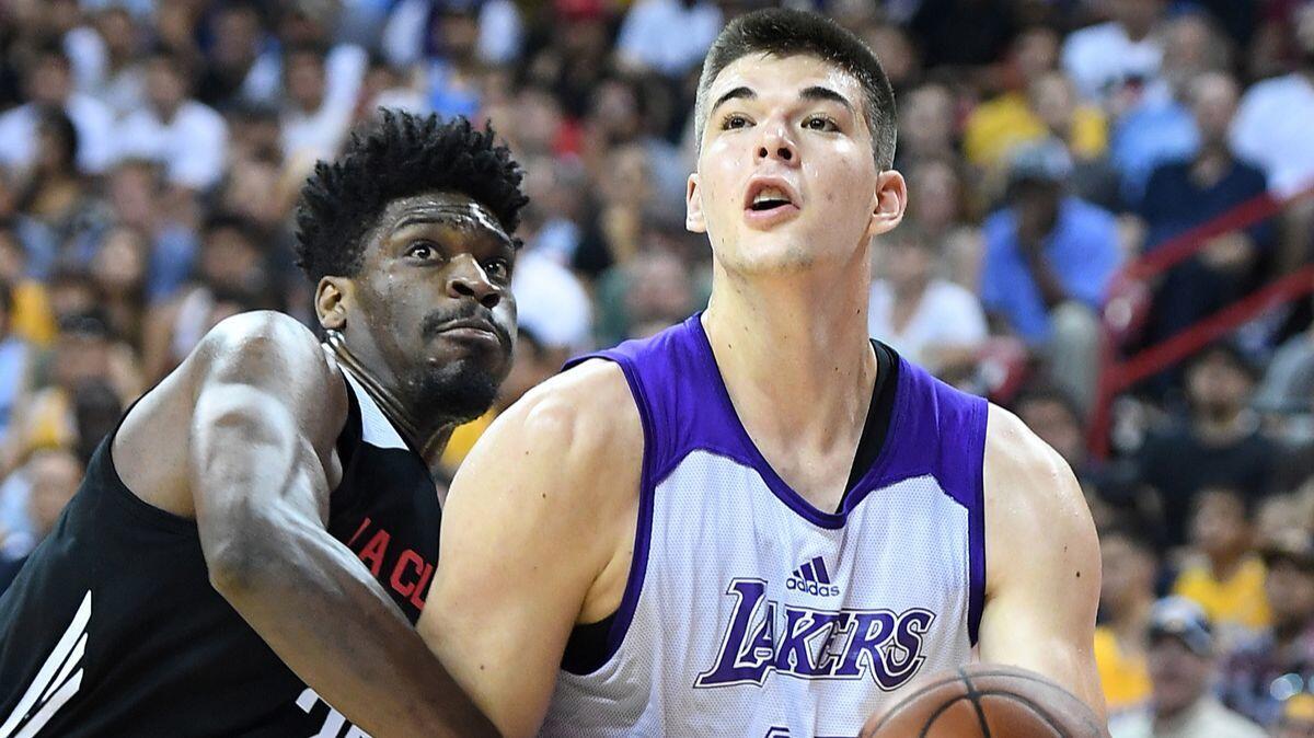 Lakers' Ivica Zubac, right, drives on Clippers' Shevon Thompson during the NBA Summer League in Las Vegas on July 7.