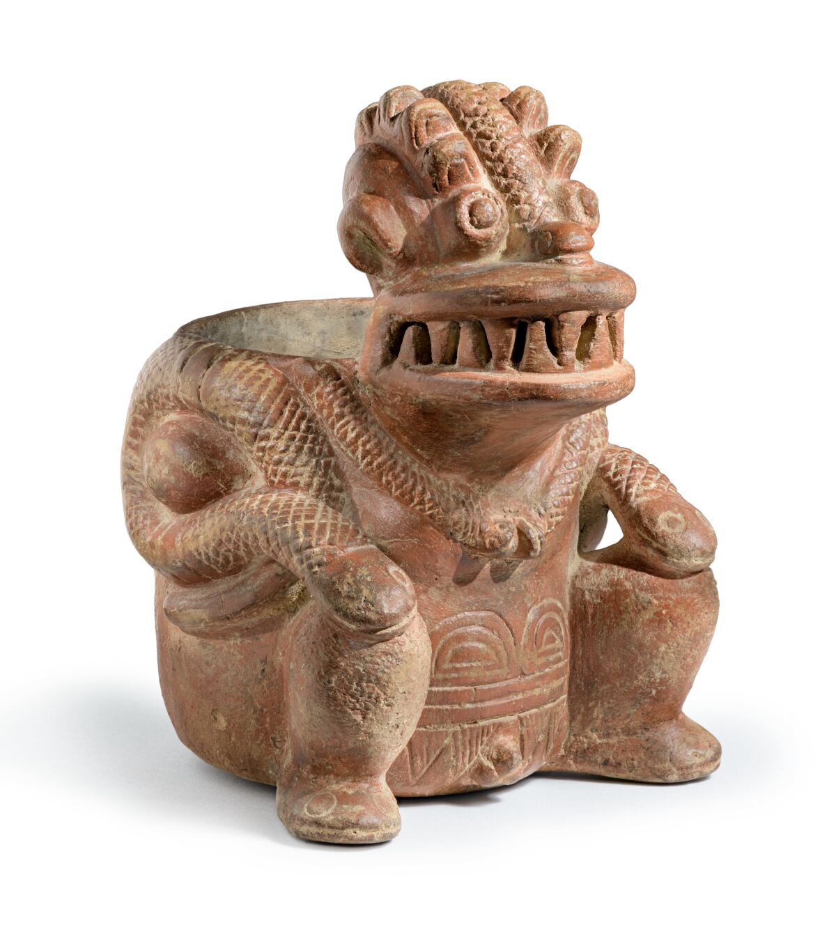 A ceramic figure of a basket-carrier.