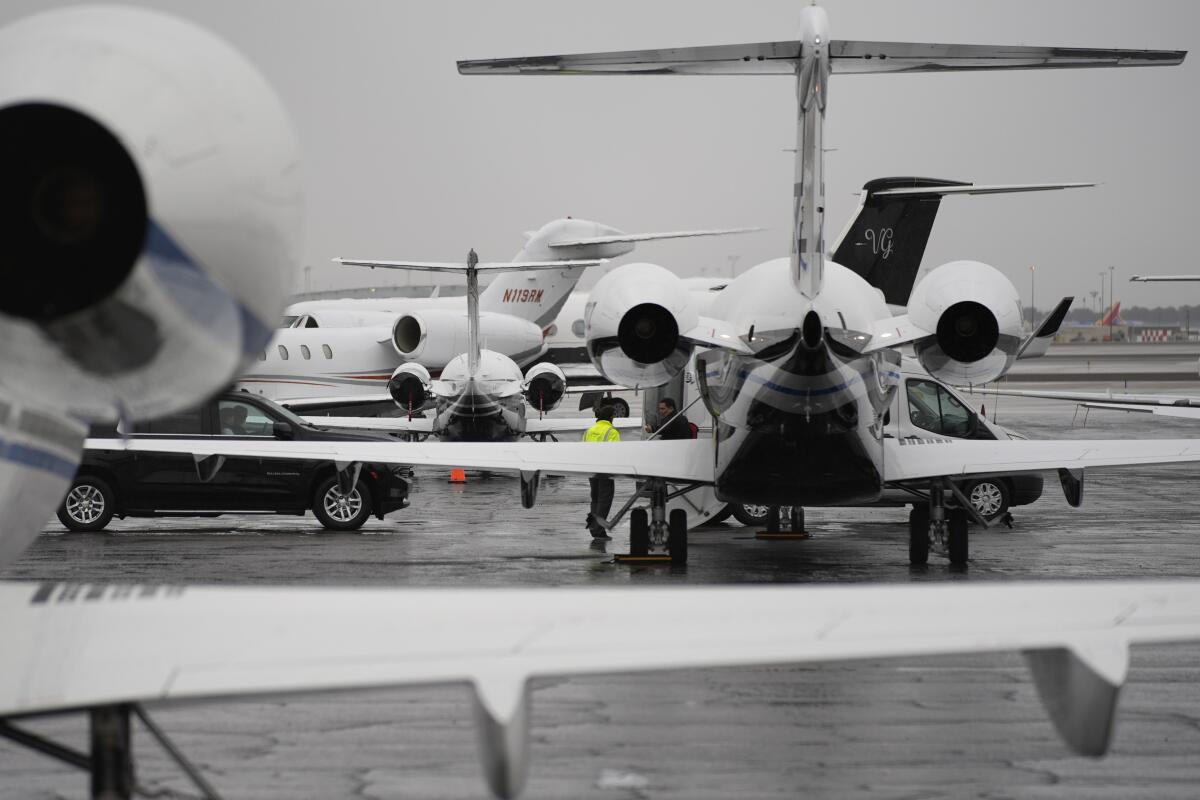Planes are parked at a private jet terminal at Harry Reid International Airport.