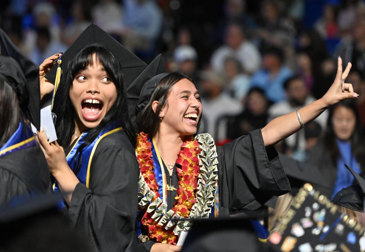 Grads celebrate at the commencement ceremony for the schools of Education and Physical Sciences at UC Irvine.