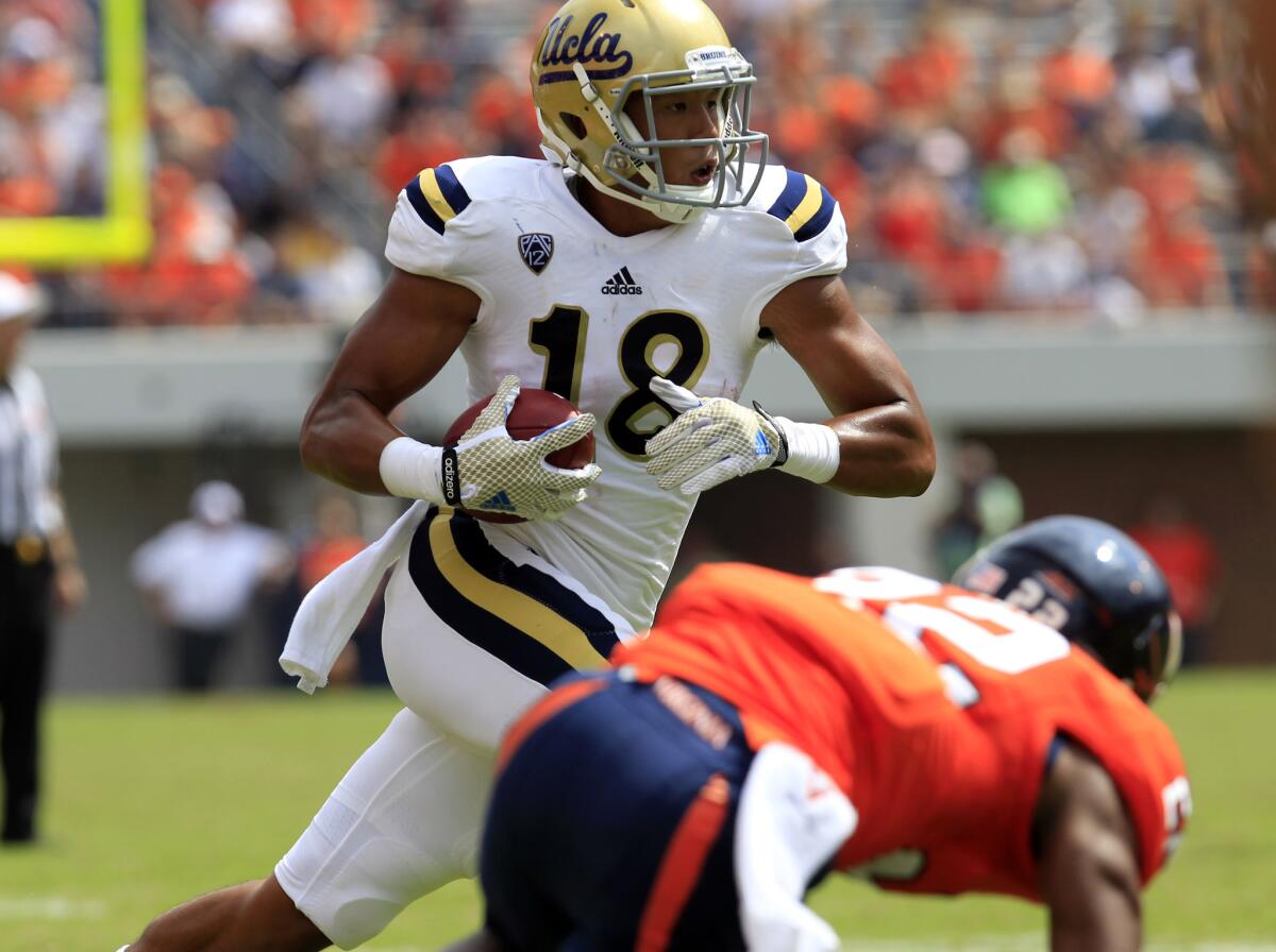 Defensive back Jalen Ortiz (18) and his defensive teammates lifted the Bruins over Virginia.