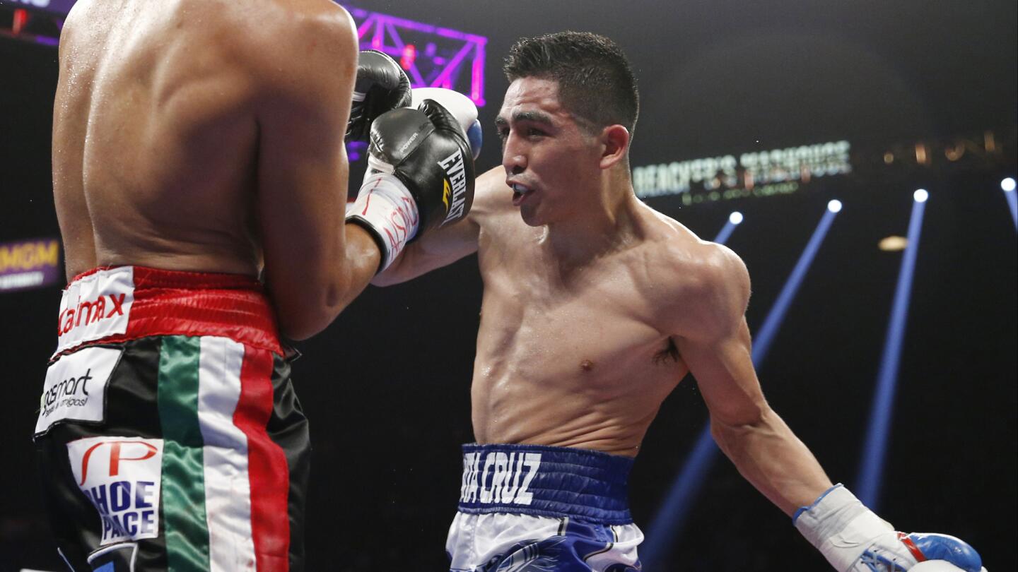 Leo Santa Cruz, right, trades blows with Jose Cayetano during their featherweight bout at MGM Grand in Las Vegas on May 2, 2015.