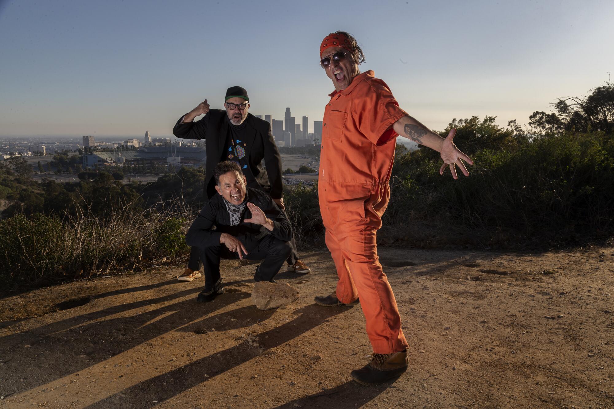 Culture Clash's Richard Montoya, Ric Salinas and Herbert Siguenza act out a baseball scene by a Dodger Stadium overlook. 