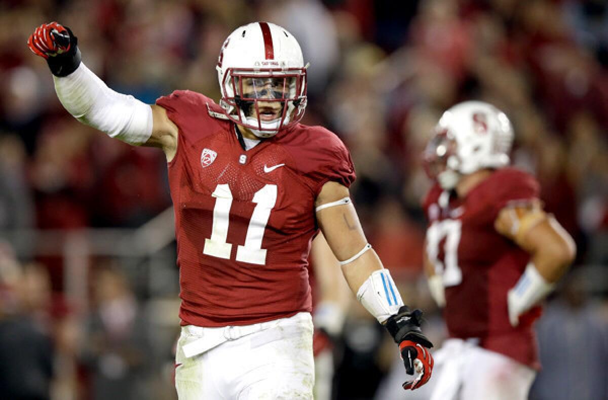 Linebacker Shayne Skov tries to fire up the Stanford faithful during a game a victory over Oregon.