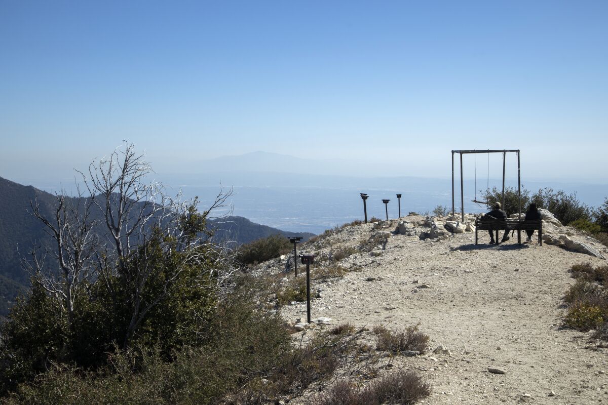 A bench, a swing and metal spotting scopes await hikers to Mt. Lowe summit. 