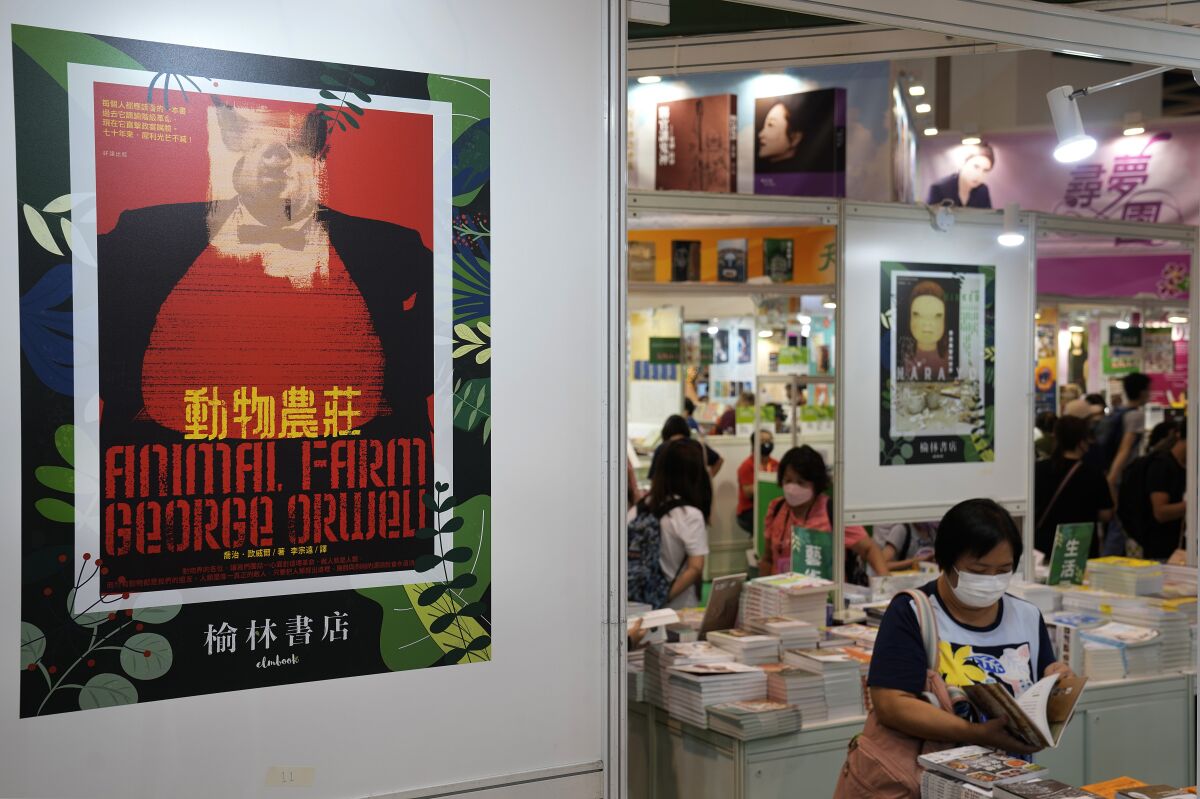 A poster of by the famous book "Animal Farm" by George Orwell is displayed at the annual book fair in Hong Kong Wednesday, July 14, 2021. The book fair was postponed twice last year due to the coronavirus. This year's event saw a reduction of politically sensitive books compared to previous years, as vendors look to avoid breaching a sweeping national security law imposed on the city last year. (AP Photo/Vincent Yu)