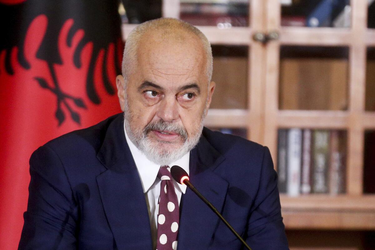 This photo provided by Albanian Prime Minister's Office shows Albania's Prime Minister Edi Rama speaking at a news conference denouncing Britain's "calculated attack" on his country referring to the increased number of Albanian migrants entering the island, in Tirana, Tuesday, Nov. 15, 2022. Britain has seen more than 40,000 migrants crossing the English Channel this year, a record high with one-third of them Albanians, which Home Secretary Suella Braverman described as an "invasion on our southern coast" also riling Albania by blaming Albanian criminal gangs for "abusing" Britain's asylum system and modern slavery laws. (Albania Prime Minister's Office via AP)