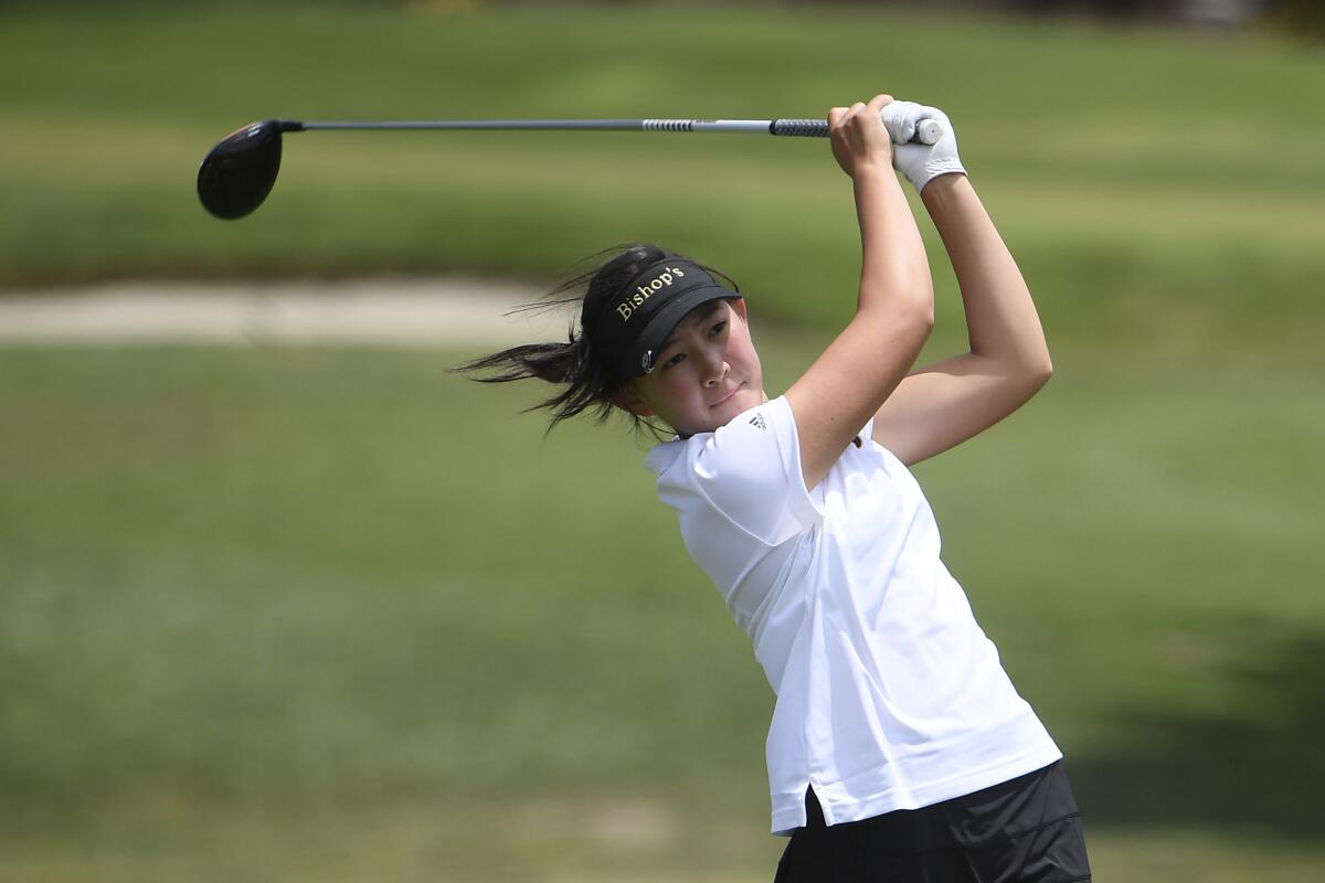 Lucy Yuan of Bishop's hits her tee shot on the 18th hole during the CIF girls golf finals.
