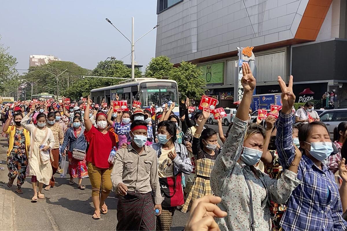 Protesters march down a street