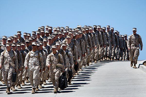 130 Marines from Camp Pendleton's Tango Battery, 5th Battalion, 11th Marine Regiment, 1st Marine Division march toward their loved ones after a seven-month deployment in Afghanistan. See full story