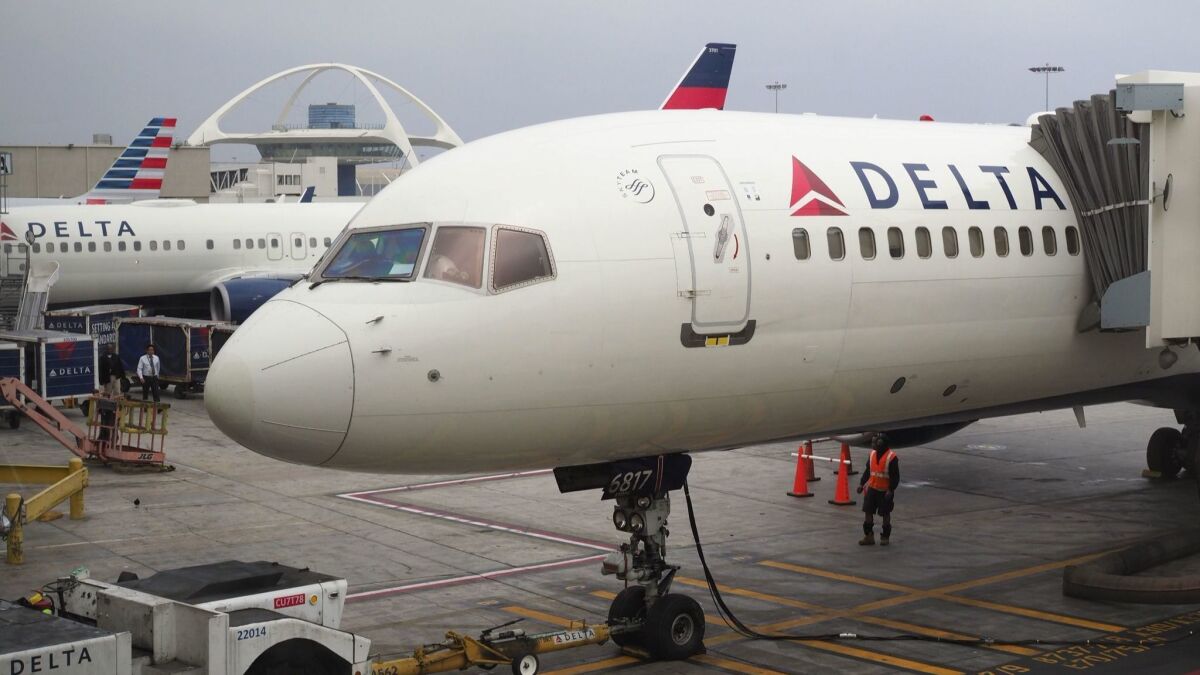 Delta Air Lines plane waits for passengers at Los Angeles International Airport