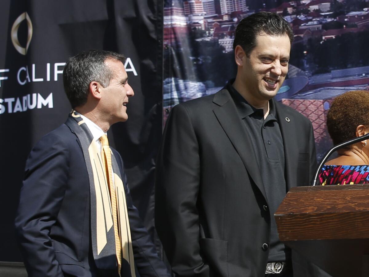 Banc Of California CEO Steven Sugarman, right, with Los Angeles Mayor Eric Garcetti, during an August news conference.