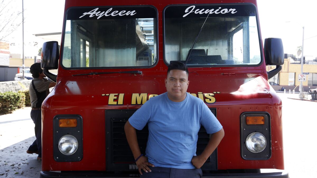 Ramon Flores with his father's truck in Boyle Heights.