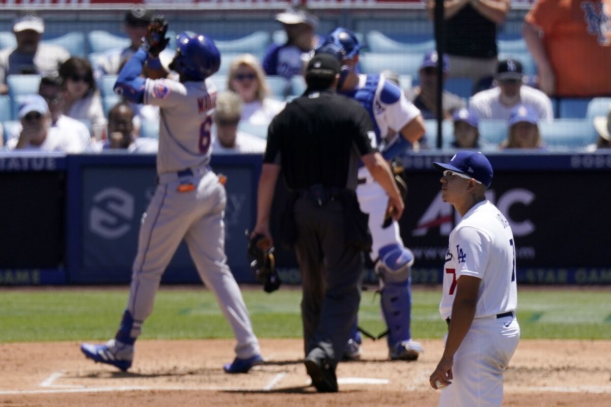 New York's Starling Marte celebrates after hitting a solo home run against Dodgers pitcher Julio Urías.