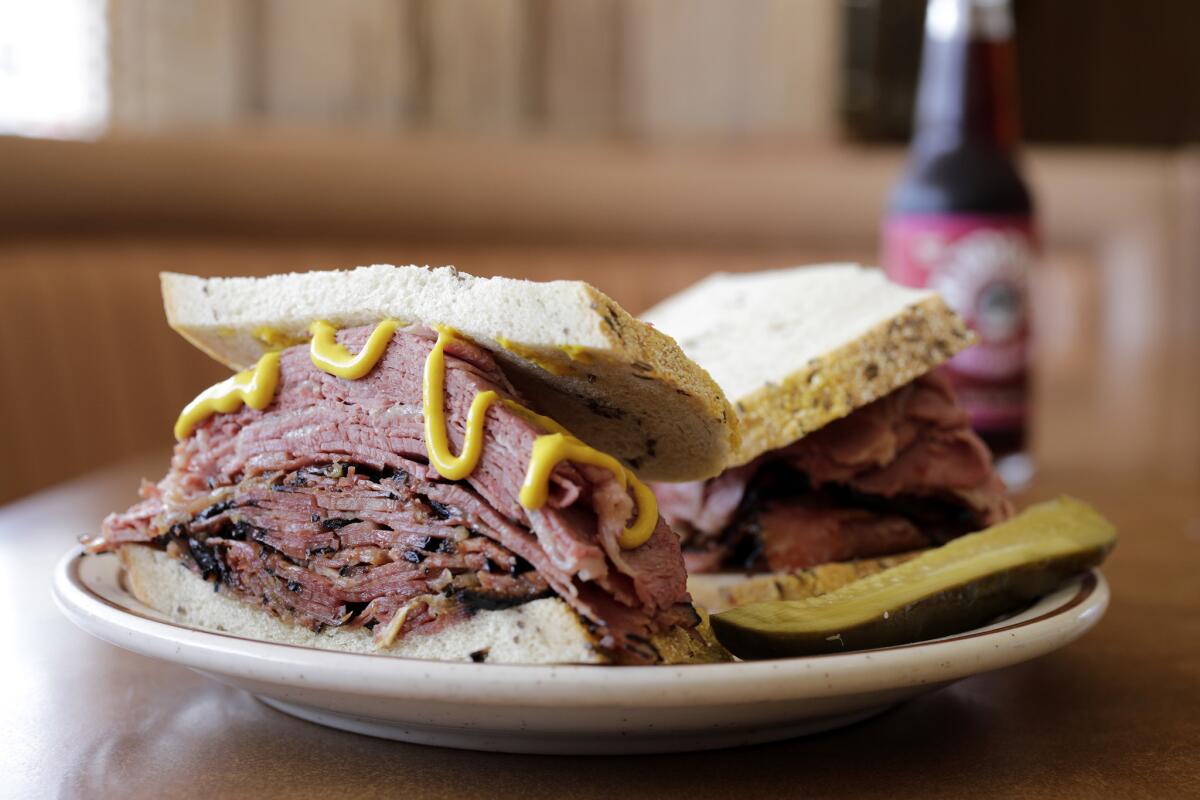 Canter's Fairfax Sandwich is hot corned beef and pastrami on rye bread with a choice of cole slaw or potato salad. The family-owned Canter's has been an L.A. institution for decades.