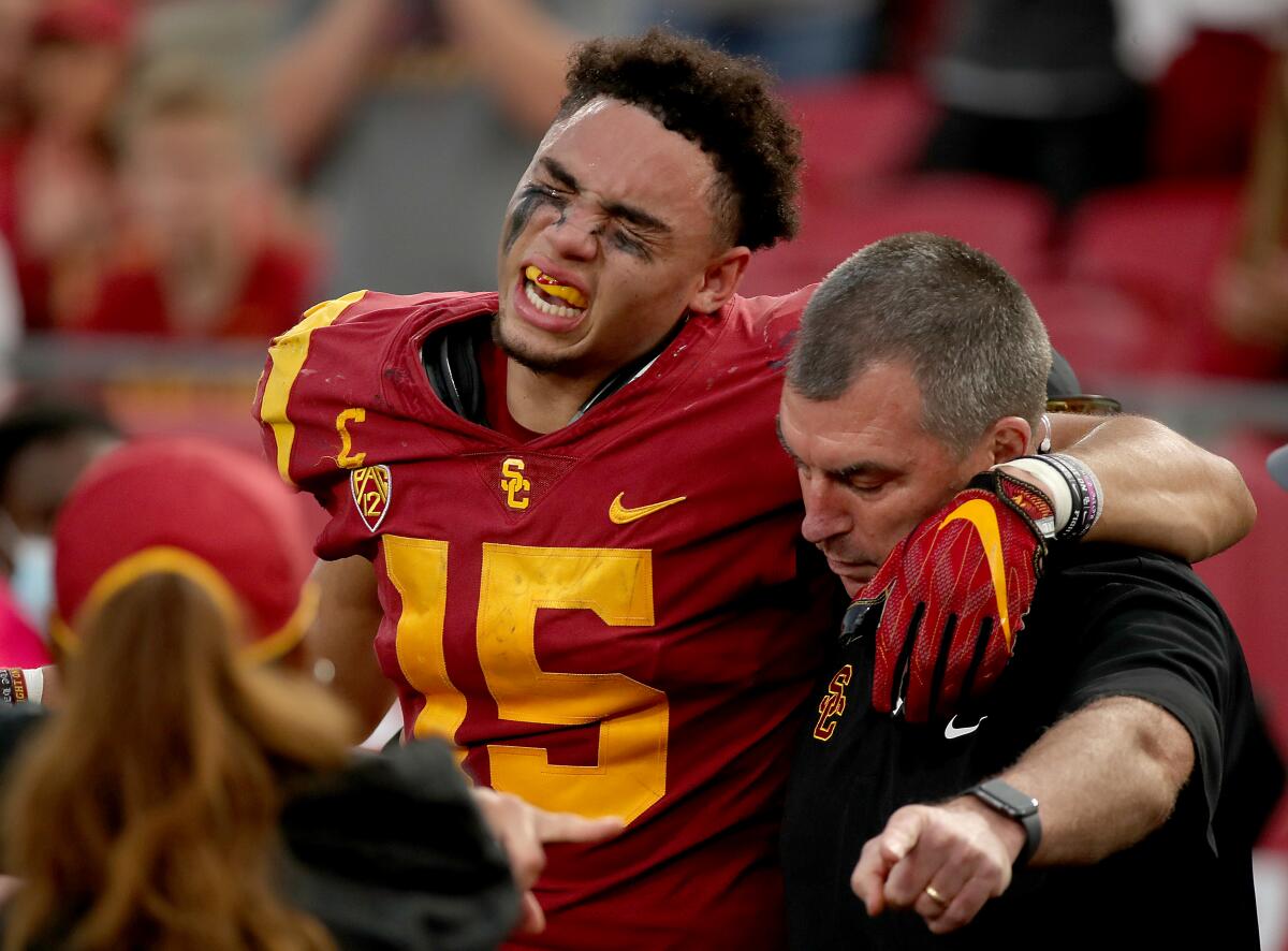 USC wide receiver Drake London winces in pain after sustaining a fractured ankle.