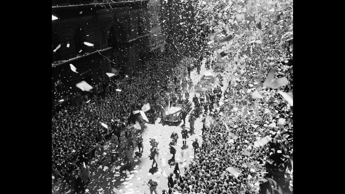 A blizzard of ticker tape and confetti virtually blots out the scene on lower Broadway as New Yorkers go all out to welcome Gen. Douglas MacArthur in New York, April 20, 1951.