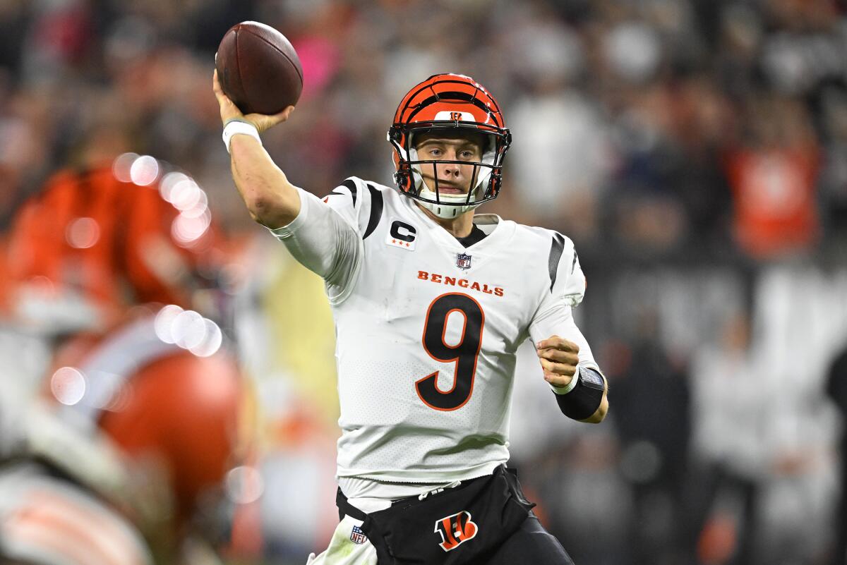 Cincinnati Bengals quarterback Joe Burrow (9) looks to throw a pass during the second half of an NFL football game against the Cleveland Browns in Cleveland, Monday, Oct. 31, 2022. (AP Photo/David Richard)