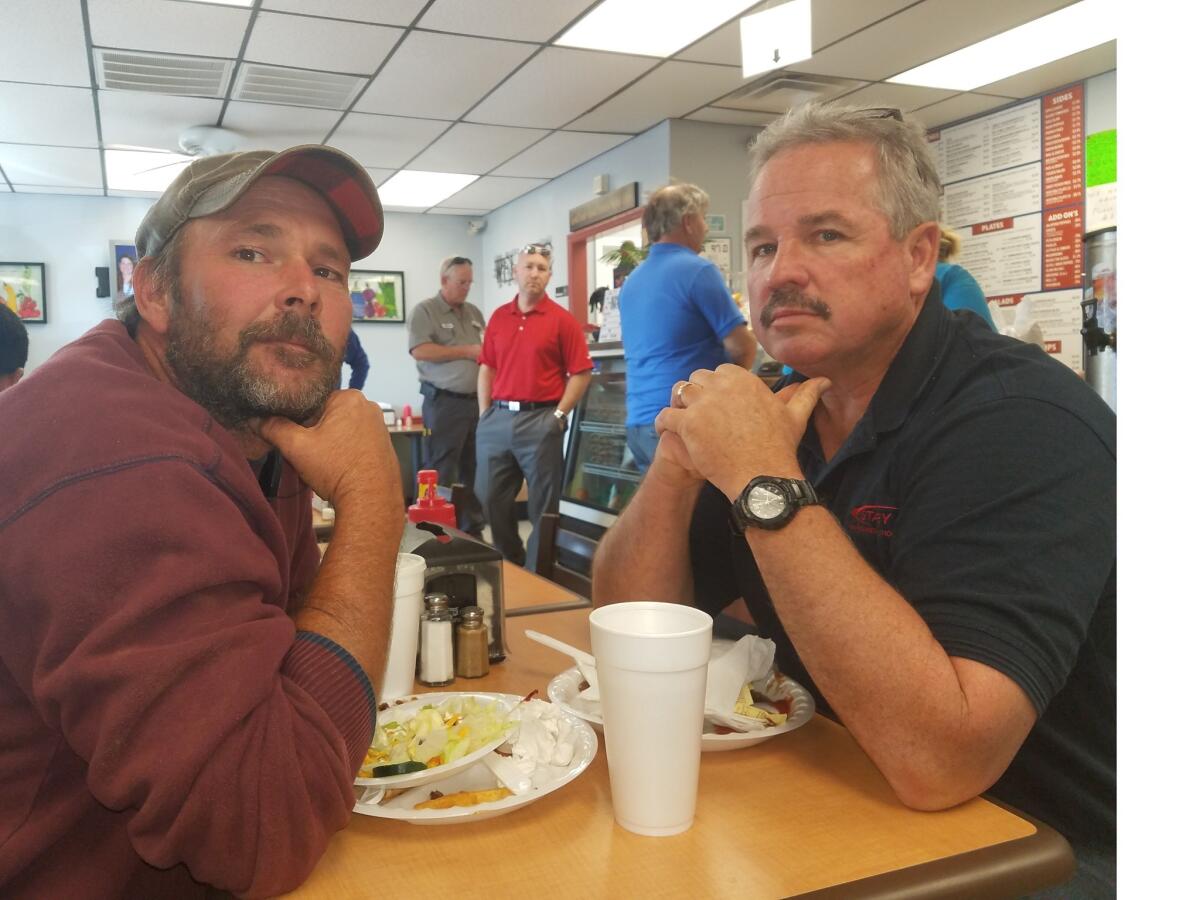 Shawn Lewis, left, and his boss, Tommy Morrison at Pete's Grill in Stanley, N.C.