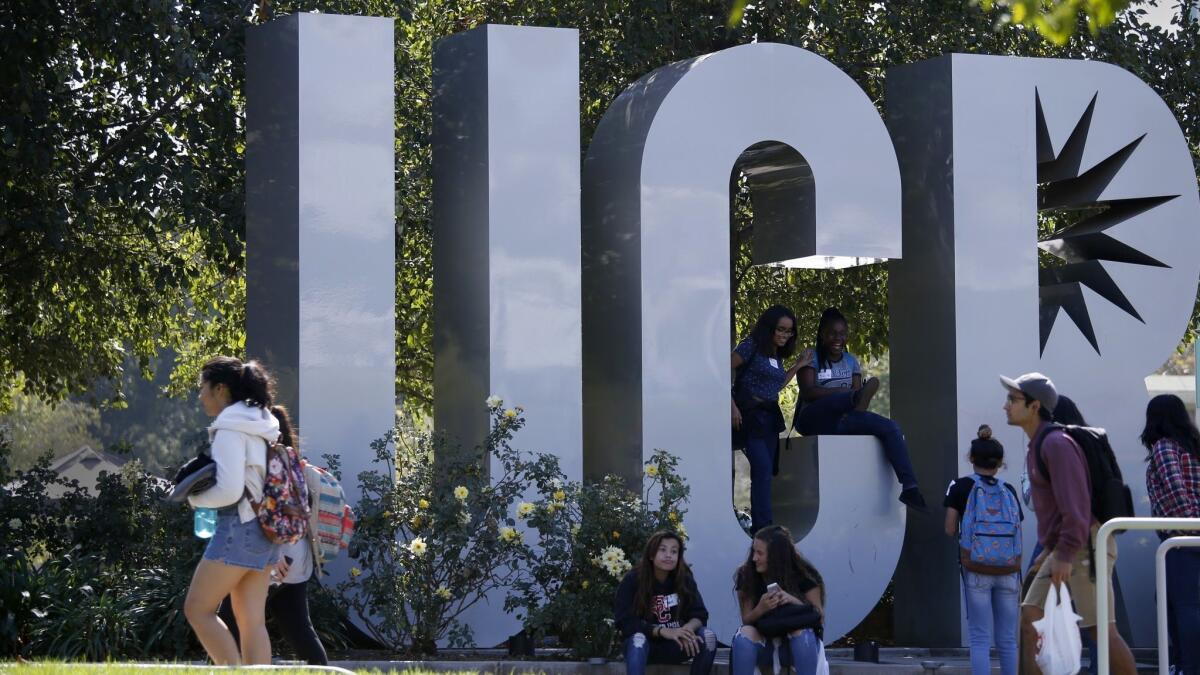 Students walk around UC Riverside in October 2016. Campus police arrested a person they say threatened to carry out a shooting at the school, authorities said Friday.