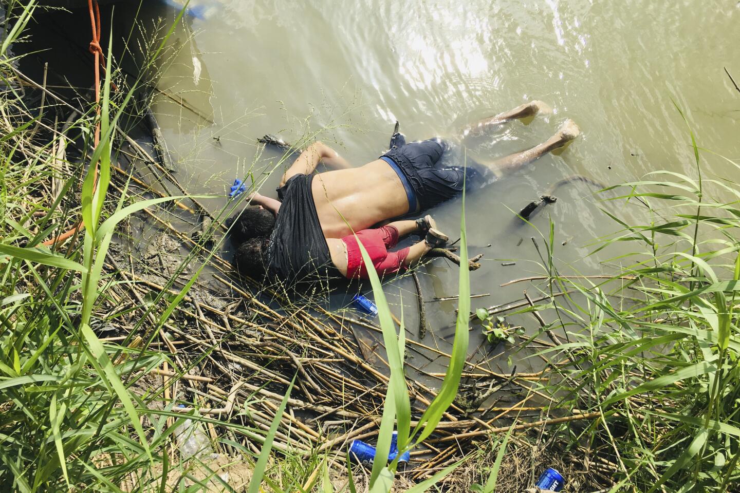 The bodies of Salvadoran migrant Oscar Alberto Martinez Ramirez and his nearly 2-year-old daughter Valeria lie on the bank of the Rio Grande on June 24, 2019, in Matamoros, Mexico, after they drowned trying to cross the river to Brownsville, Texas. According to reports, Martinez had gone back into the river to get his wife after he had safely gotten their young daughter across the river. Valeria followed her father back in the river and as he tried to retrieve his daughter, they were both swept away. Martinez' wife, Tania told Mexican authorities she watched her husband and child disappear in the strong current.