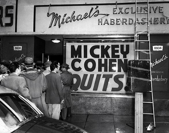 Mickey Cohen sells out the stock of his haberdashery to cover the bail money of two missing associates: Dave Ogul and Frank Niccoli.