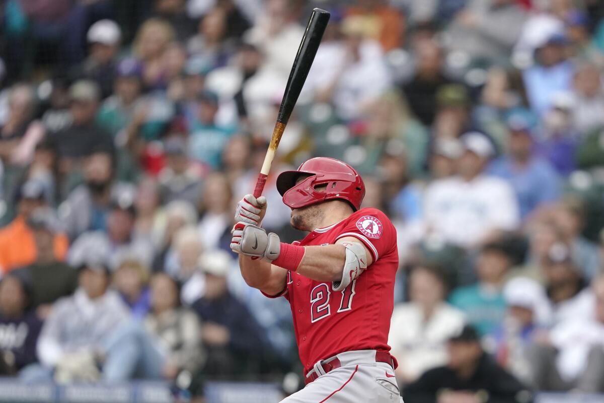 The Angels' Mike Trout watches his 10th-inning, two-run home run in a doubleheader opener at Seattle on June 18, 2022.
