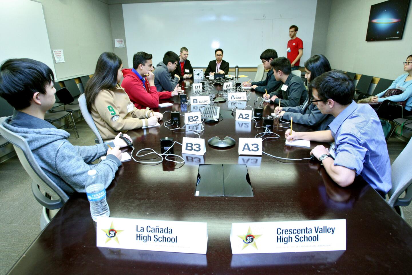 The La Cañada High School team, left, competed vs. the Crescenta Valley High School team in the first round of the 25th annual JPL Regional Competition of the 2017 National Science Bowl, at the Jet Propulsion Laboratory in La Cañada Flintridge on Saturday, Jan. 28, 2017. Other local teams competing included Hoover High School and Clark Magnet.