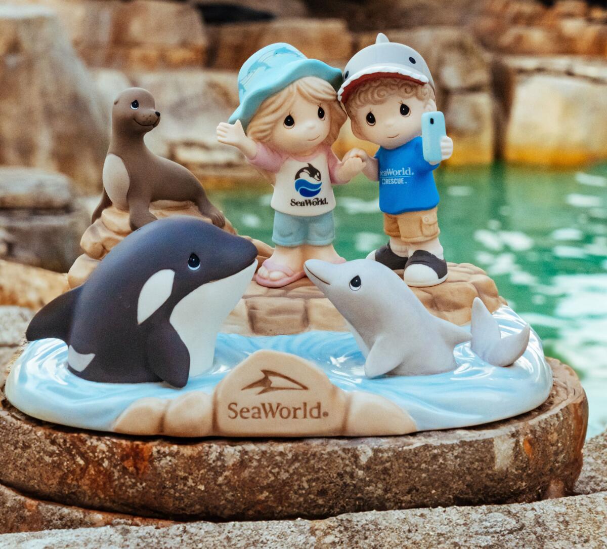 SeaWorld 60th anniversary Precious Moments figurine.