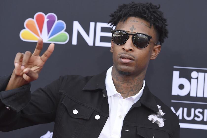 FILE - In this Sunday, May 20, 2018, file photo, 21 Savage arrives at the Billboard Music Awards at the MGM Grand Garden Arena in Las Vegas. It was a shock for fans when 21 Savage was taken into custody Sunday, Feb. 3, 2019, by U.S. immigration agents in Georgia. It was an even bigger shock to learn he had been an immigrant in the first place. (Photo by Jordan Strauss/Invision/AP, File)