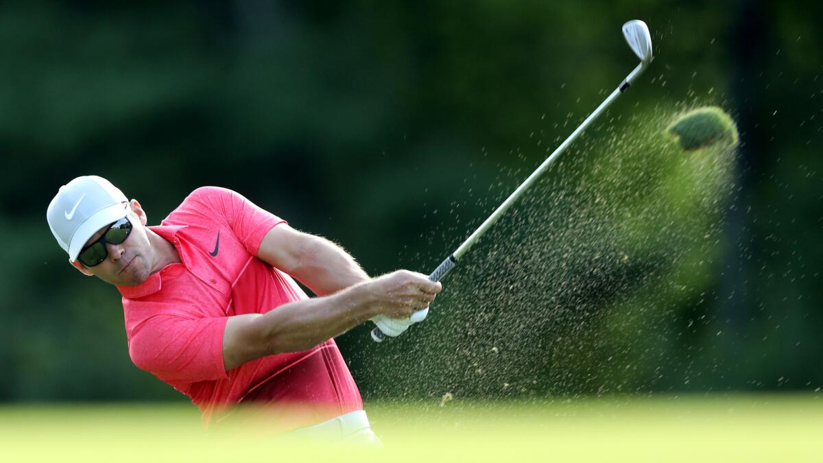 Paul Casey hits an approach shot at No. 15 during the third round of the Deutsche Bank Championship on Sunday.