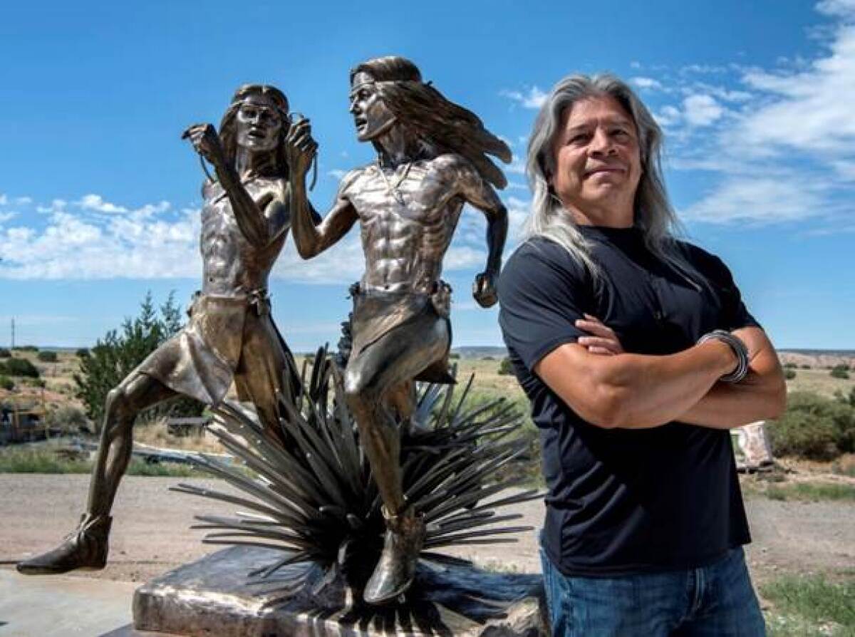Artist Raymond Nordwall and his sculpture