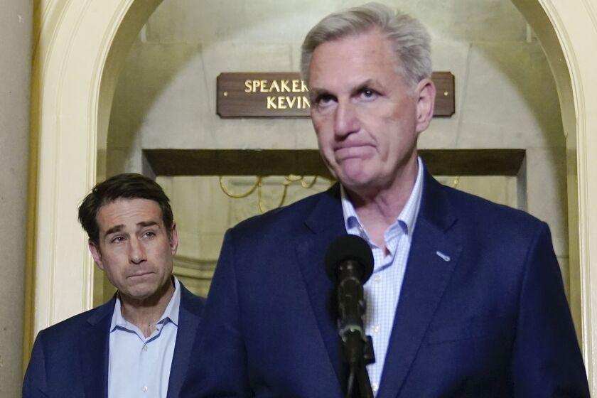 Rep. Garret Graves, R-La., left, looks to House Speaker Kevin McCarthy of Calif., before leaving after McCarthy announced that he and President Joe Biden reached an "agreement in principle" to resolve the looming debt crisis on Saturday, May 27, 2023, on Capitol Hill in Washington. (AP Photo/Patrick Semansky)