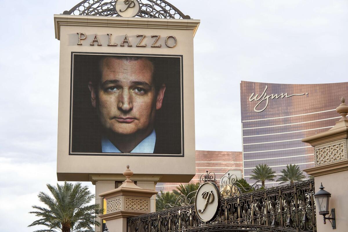 The image of Republican presidential hopeful Ted Cruz is seen in a display announcing the upcoming Republican presidential debate in Las Vegas, Nev. on Dec. 14.