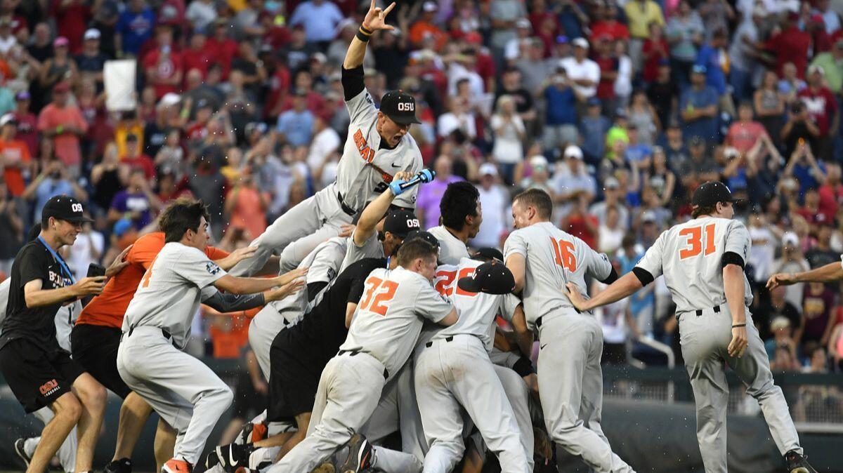 Oregon State players celebrate after winning the College World Series on Thursday. Oregon State defeated Arkansas 5-0.