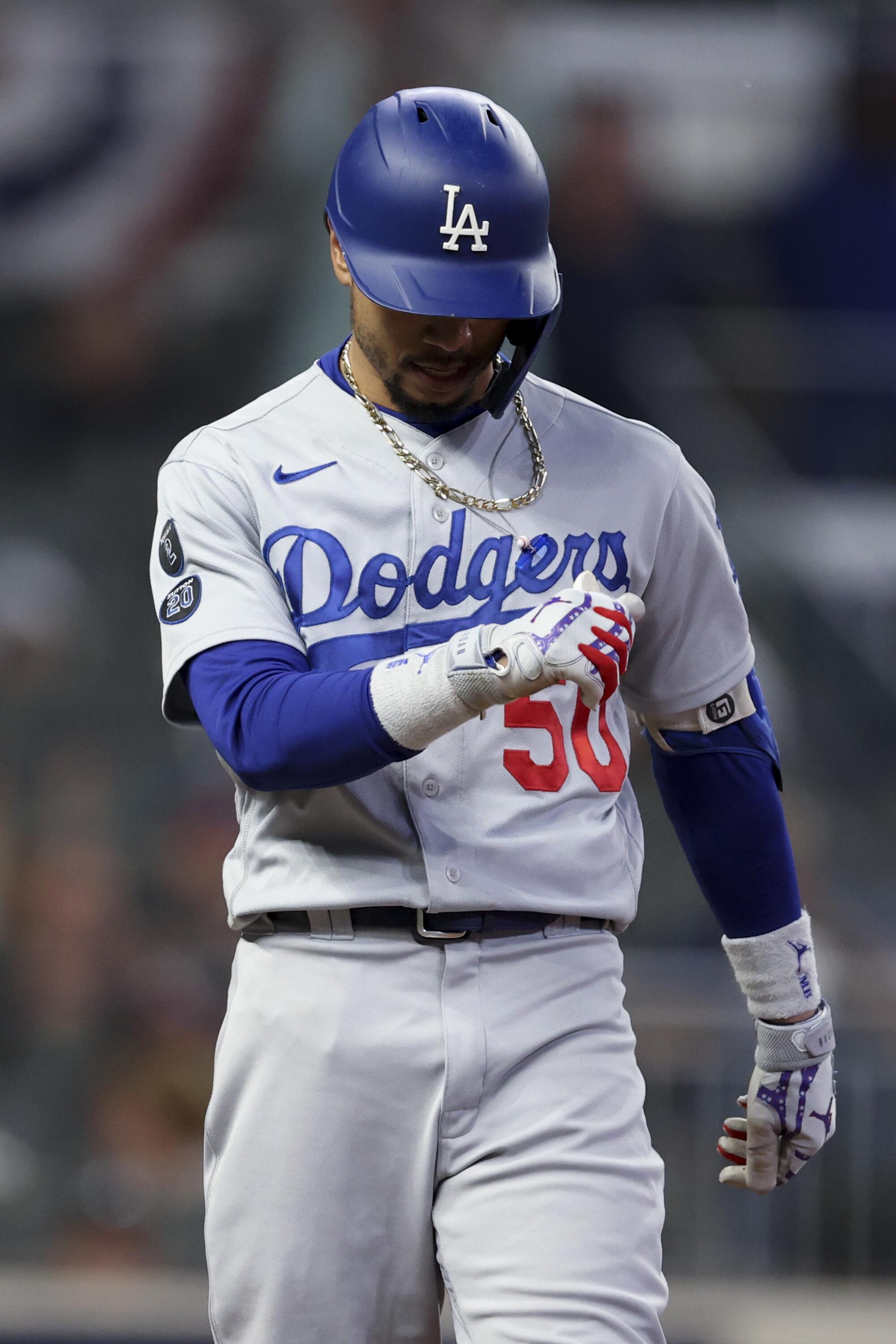 Los Angeles Dodgers' Mookie Betts reacts after grounding into a double play during the fifth inning