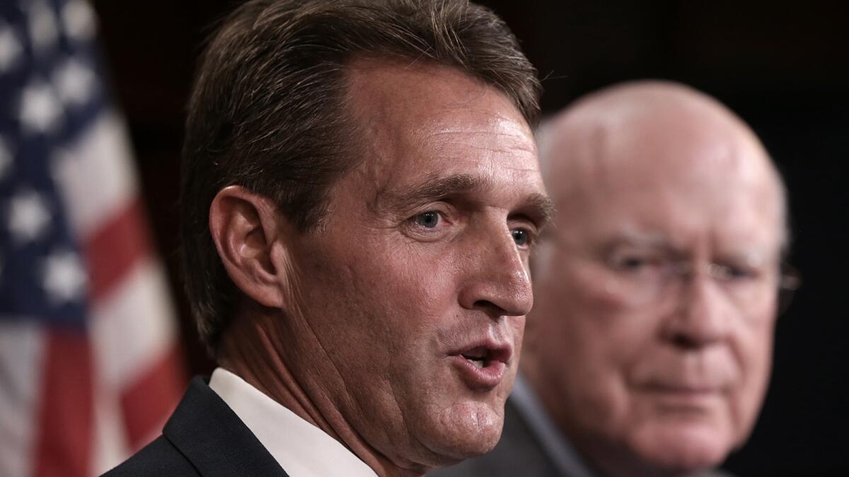 Sen. Jeff Flake (R-Ariz.) said that "it's time to try something new" because existing Cuba policy has not worked. Sen. Patrick J. Leahy (D-Vt.) is at right.