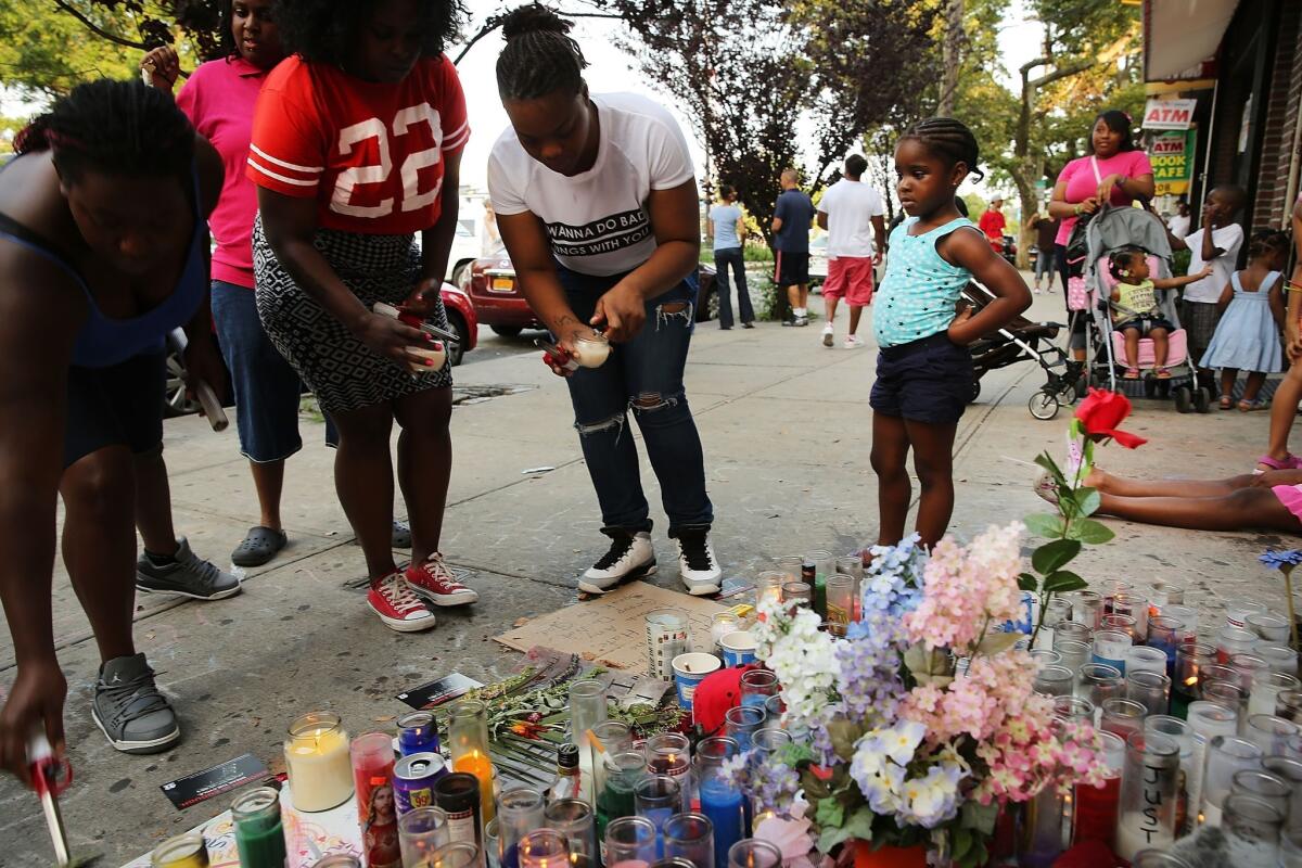 Staten Island, N.Y., residents visit a memorial for Eric Garner the day before his funeral, which was held in Brooklyn.
