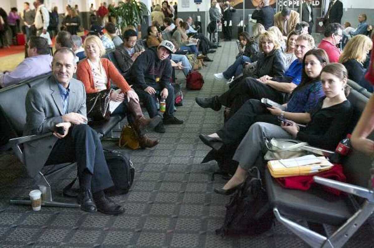 Travelers wait for their flight at Bob Hope Airport. For the first time in more than three years, the number of passengers at Bob Hope Airport increased in March.