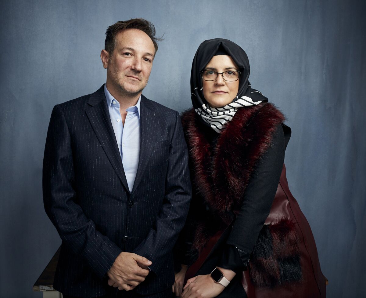 FILE - Director Bryan Fogel, left, and Hatice Cengiz, fiancee of the murdered journalist Jamal Khashoggi, pose for a portrait to promote the film "The Dissident" during the Sundance Film Festival in Park City, Utah on Jan. 24, 2020. Briarcliff Entertainment said Wednesday that it has acquired “The Dissident” and will release it theatrically and via on-demand in late 2020 to coincide with the second anniversary of Khashoggi’s death. (Photo by Taylor Jewell/Invision/AP, File)