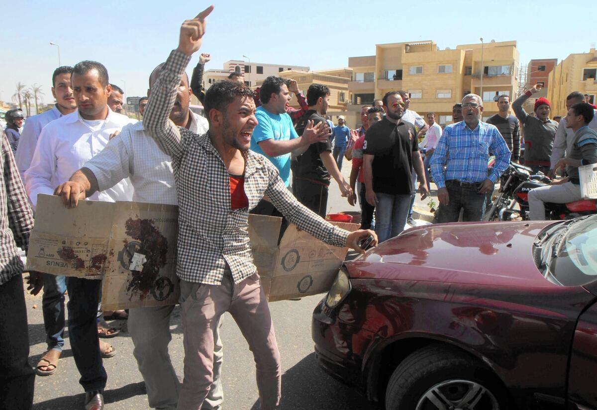 Egyptians gather to denounce the fatal shooting of a street vendor by a police officer asked to pay for his cup of tea.