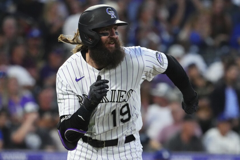 Colorado Rockies' Charlie Blackmon runs to first on a double against the Los Angeles Dodgers during the sixth inning of a baseball game Tuesday, June 28, 2022, in Denver. (AP Photo/Jack Dempsey)
